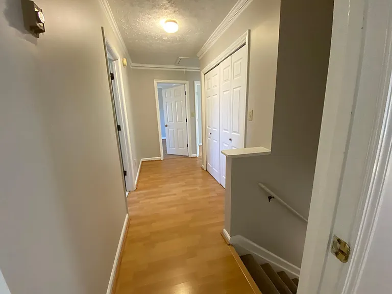 View from the Primary bedroom to the hallway and other bedrooms.