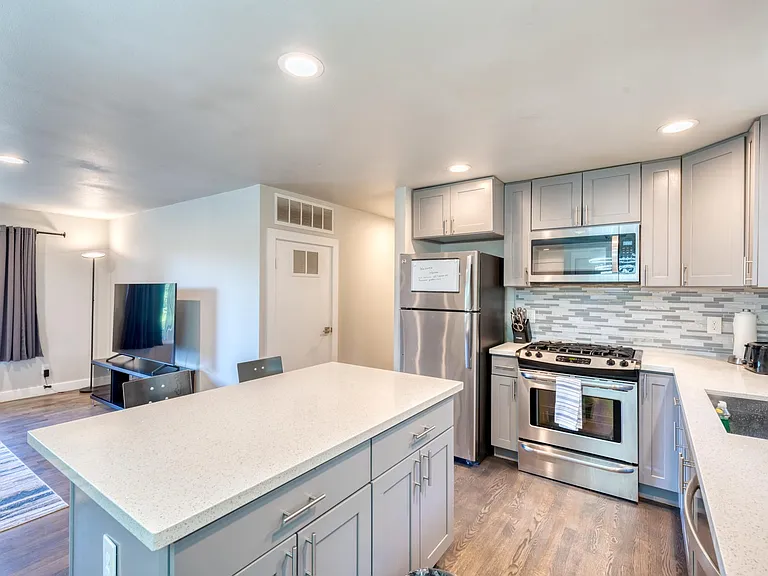 Newer kitchen with stainless steel appliances and gas range for serious cook