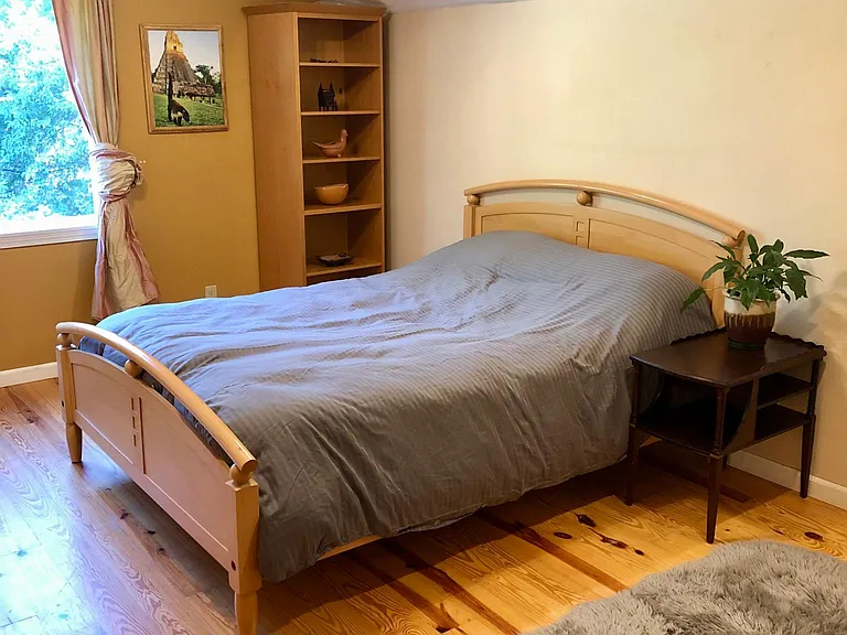 Bedroom #2, queen bed and cozy relaxing space. This room also looks out over the backyard and forest.