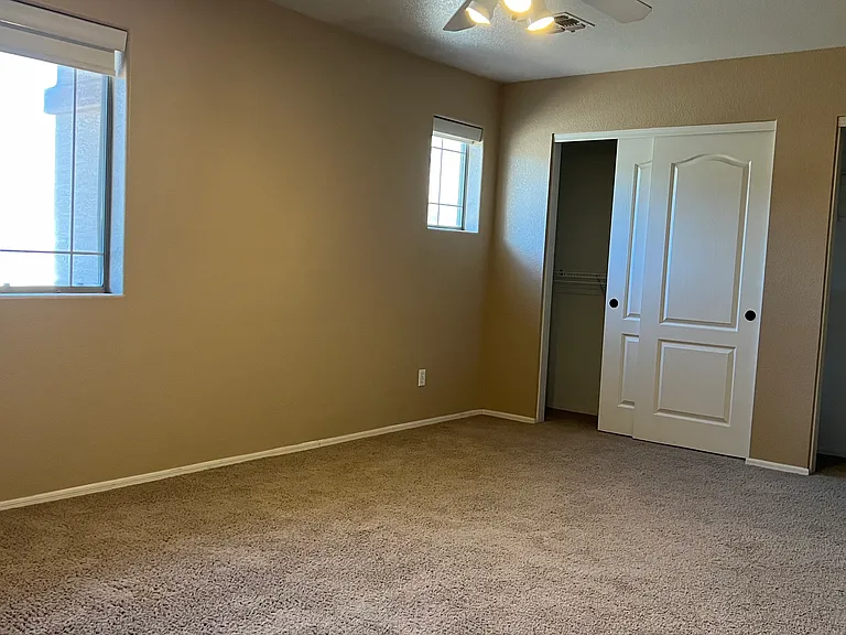 upstairs bedroom with 2 closets and access to full bathroom (shower and tub and toilet in separate room from double sinks), great mountain views; upstairs is on separate AC and Furnace from downstairs, linen closet nearby and laundry shoot