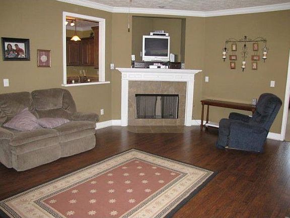 living room with gas fireplace (ready for new logs)