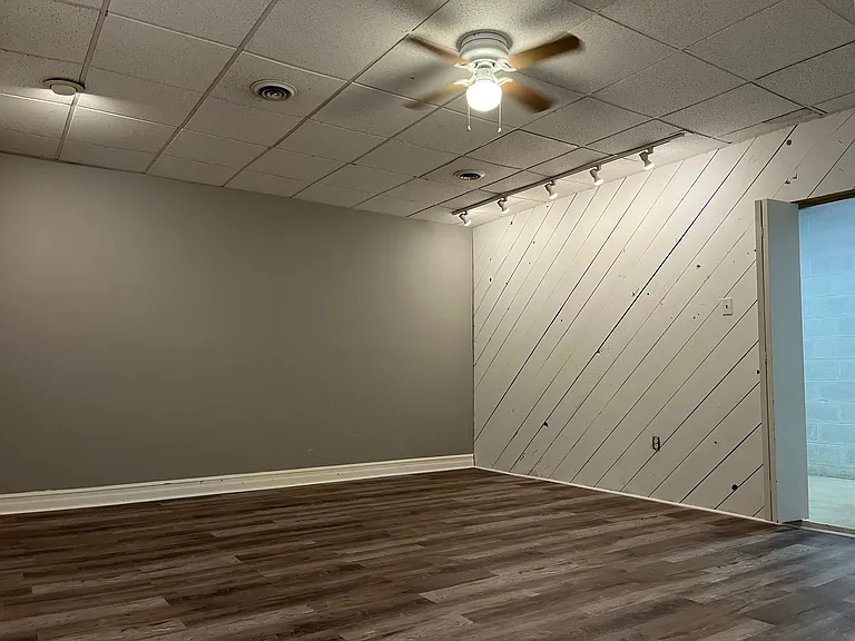 Enter unit via large finished basement space with additional storage areas.