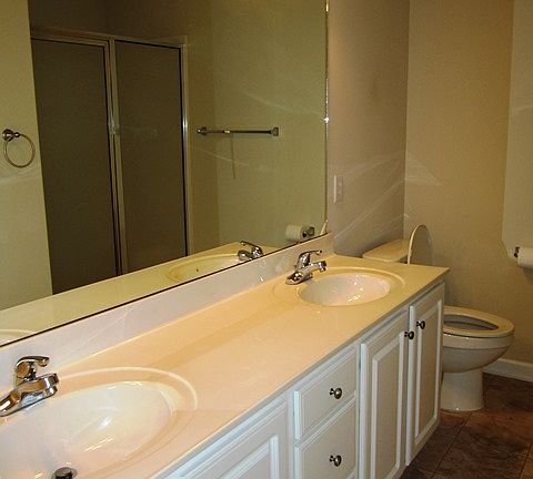 Master Bathroom with Double Sink and Standing Shower