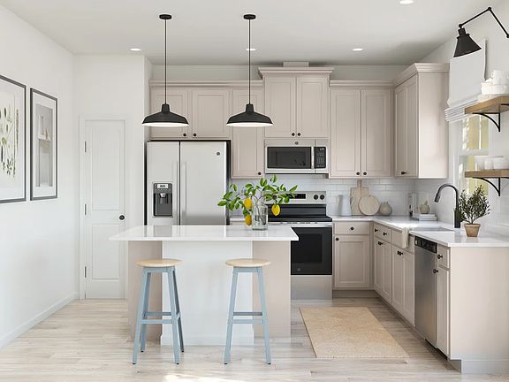 Kitchen with pendant lights over island