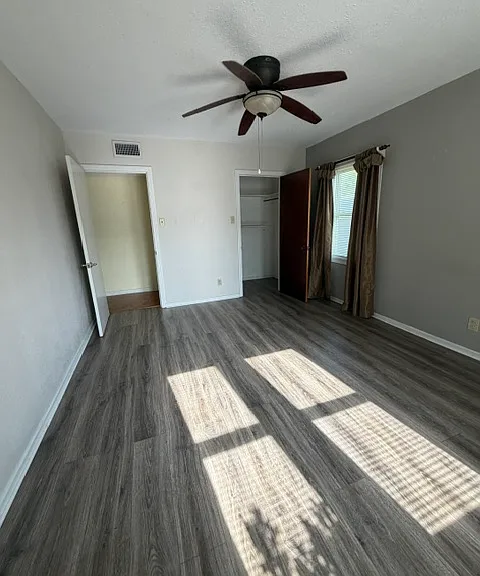 master bedroom with walk in closet