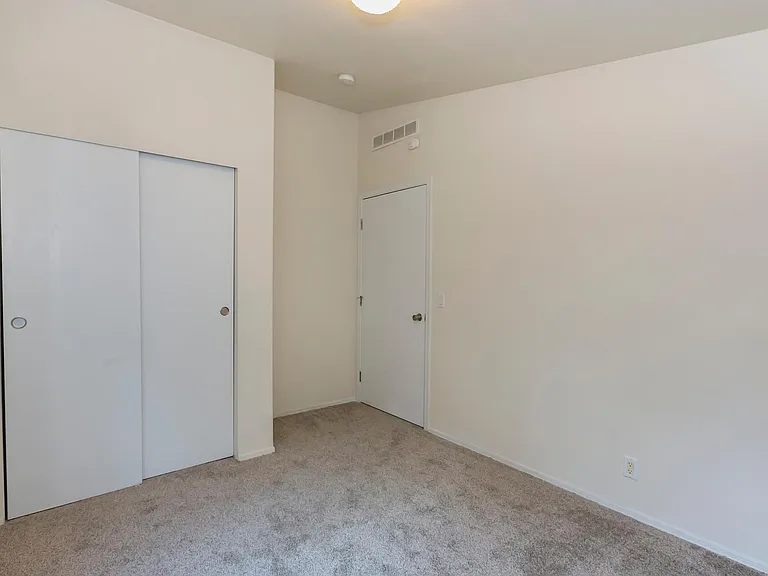 Entryway and closet in den.