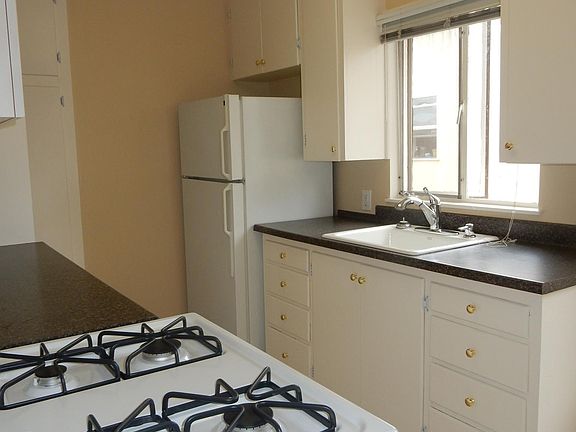 Kitchen has new stove, flooring and paint