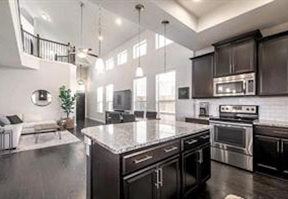 Kitchen opens up to living space