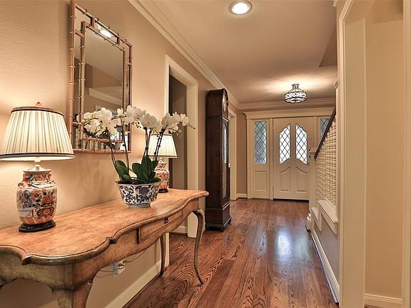Foyer is spacious and so classy. These are solid red oak hardwood floors. They run throughout the downstairs and have been recently refinished for the lucky buyer. These floors are truly pristine and will stand the test of time. Very versatile and wi