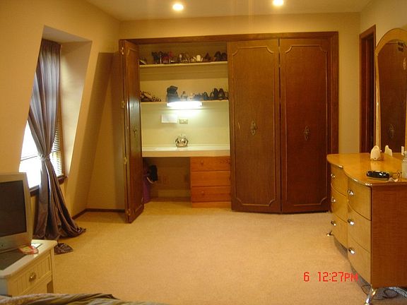 Master bedroom built in desk, closet, & sitting area.