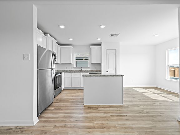 A kitchen island provides extra counter space and storage