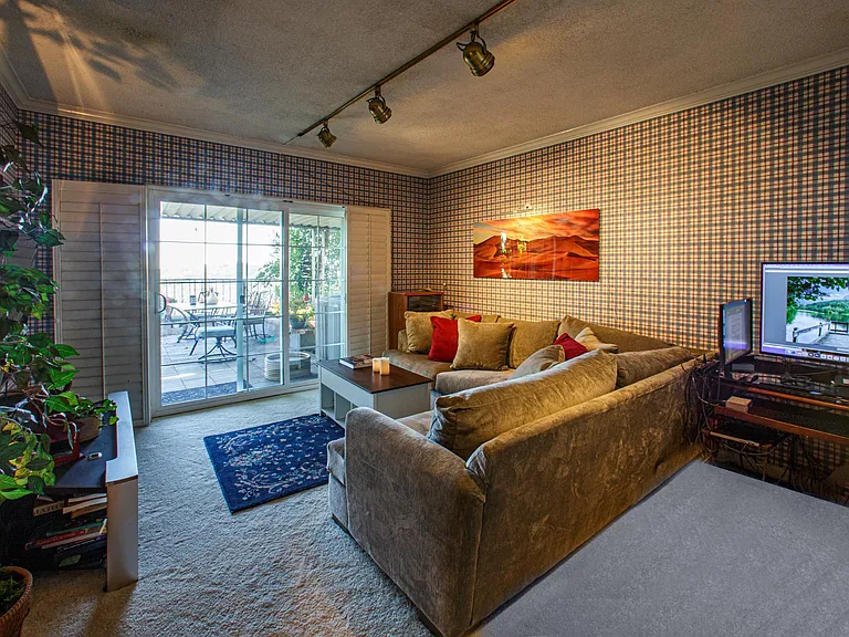 This entertainment room is chocked full of surprises, a wet bar, computer station, large screen Tv and and a spectacular patio view overlooking the City of Angels.