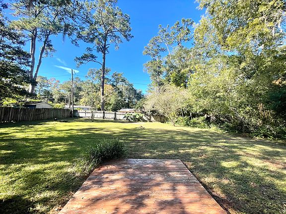Deck and fenced backyard