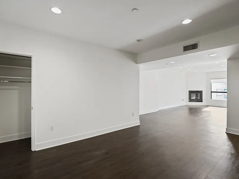 Spacious Dining and Living Room Area with a Hall Closet, Electric Fireplace and Vinyl Flooring