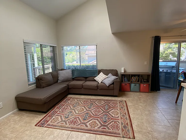 Open concept living room with sklylights
