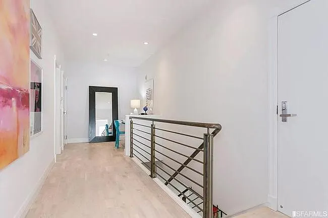 2 entry way, to the 2nd floor leading to bedrooms. Office/workout/storage area.