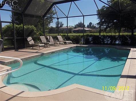 GIANT heated pool with expanded patio area for sunning and lake viewing