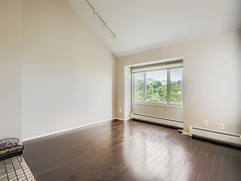 Living room with 12-foot ceilings faces north with direct views of Mt. Sanitas