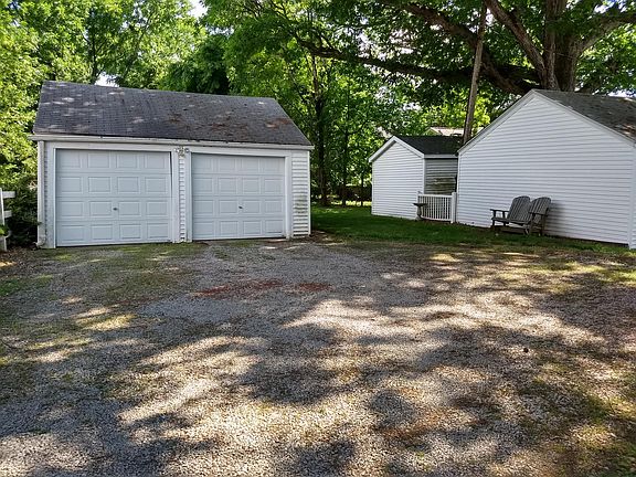 Garage with parking and shaded sitting area