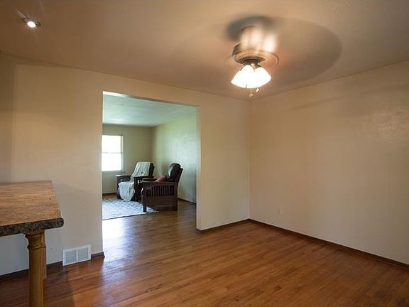 The freshly painted dining room is open to the living room and the upper level sun room with a break