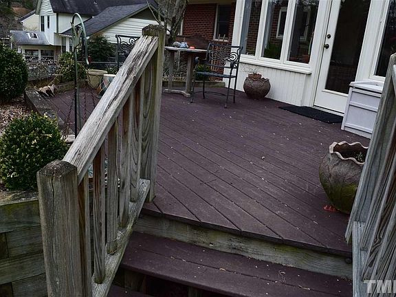 Deck with Trex type flooring and flower bed.