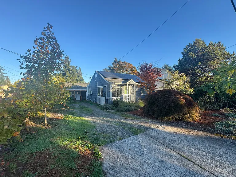 House is situated on a quiet street corner where kids can play outside without worrying about cars zooming by. The property includes thriving grape vines, fig and plum trees and more!