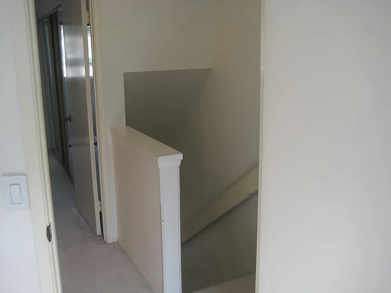 Top of stairway to bedrooms and bathroom