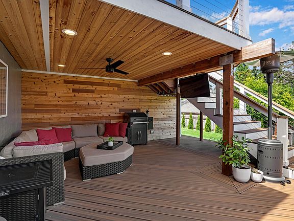 Covered deck is a wonderful place to entertain, take in the view and relax with the built in TV and smart lights