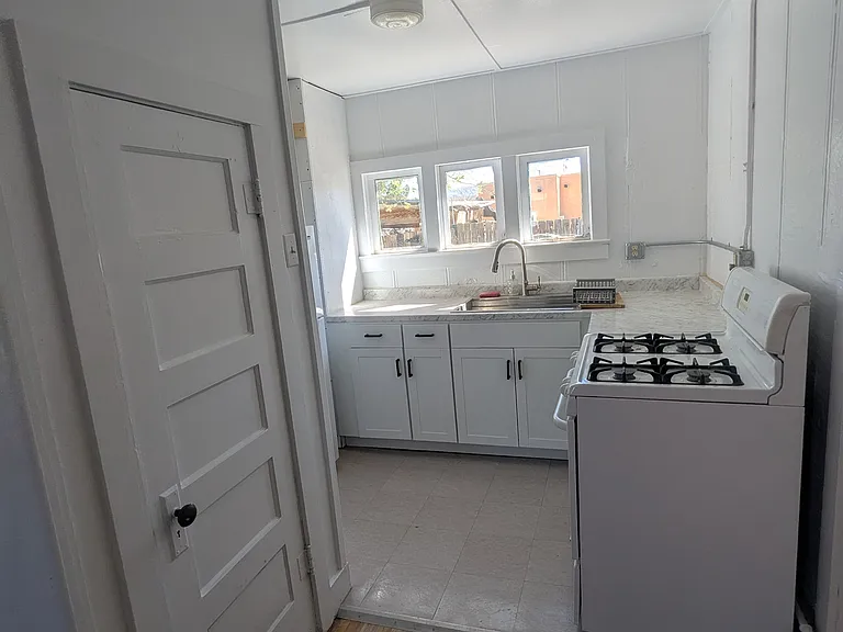 Open floor plan between living room and remodeled kitchen.