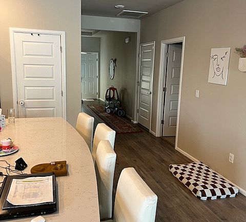 Hallway to front door/interior garage door/laundry room/two of the bedrooms