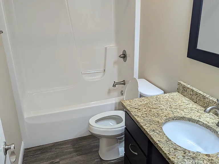 hall bathroom with tub