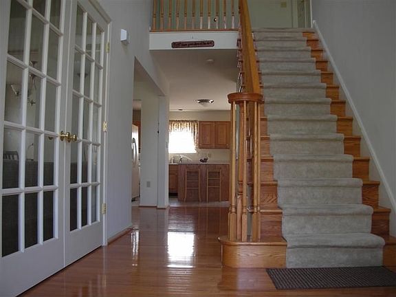 Stunning 2-story foyer with upgraded hardwood flooring.
