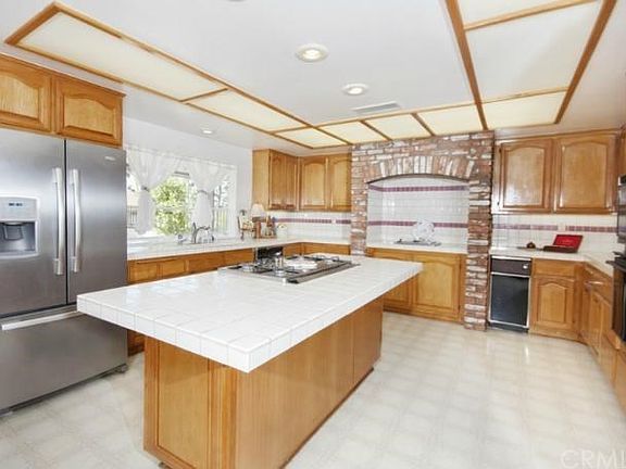 Huge kitchen has an island, walk-in pantry, gardner window, etc.