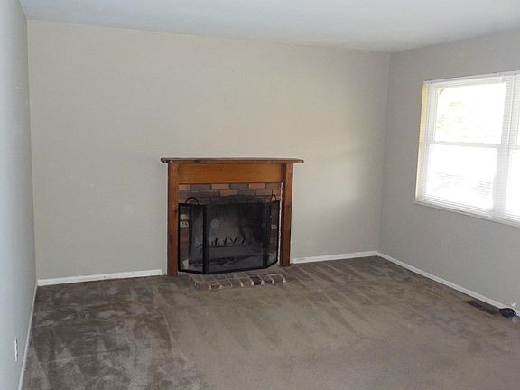 Living room with wood burning fireplace