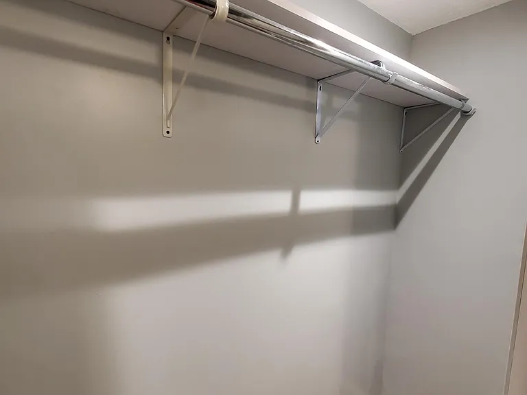 Lighted, walk-in closet in master bedroom.