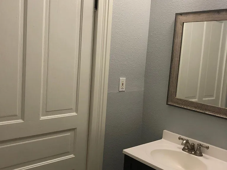 Large full bath from main level bedroom # 2 (1 of 2 pics).