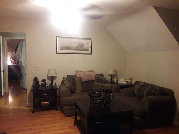 Area to the left of the table, still main living room. On th