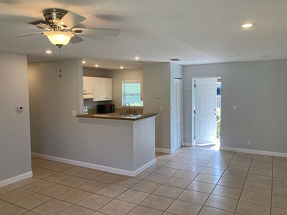 View from LR toward Kitchen & Dining Area, Coat Closet & Front Door