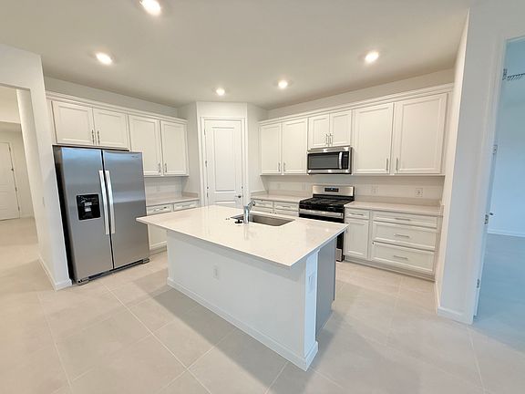 Kitchen with walk in pantry in the corner