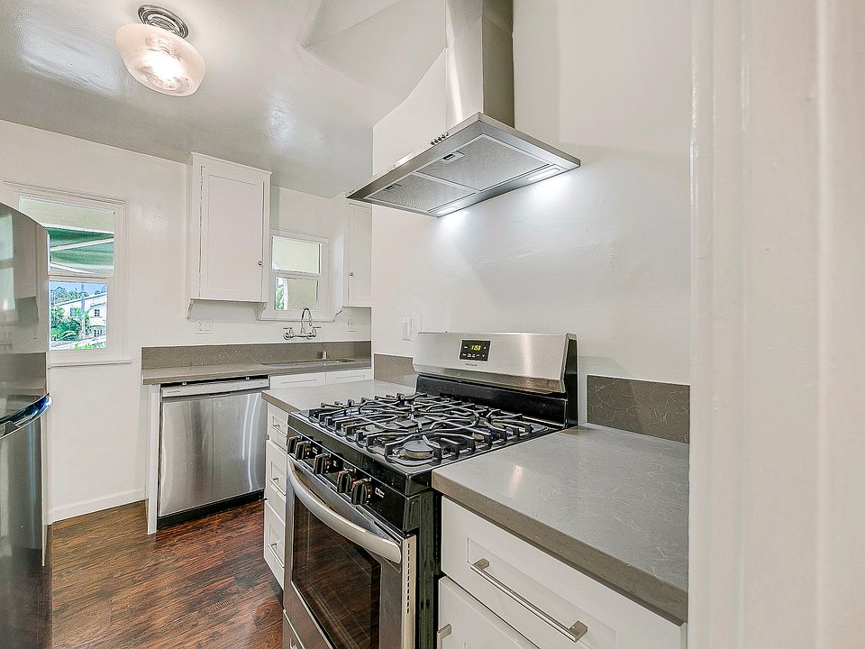 Updated kitchen with stainless steel appliances. Dishwasher, refrigerator, stove, plenty of cabinet space.