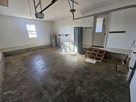 The attached garage is 1 car with laundry and water heater.