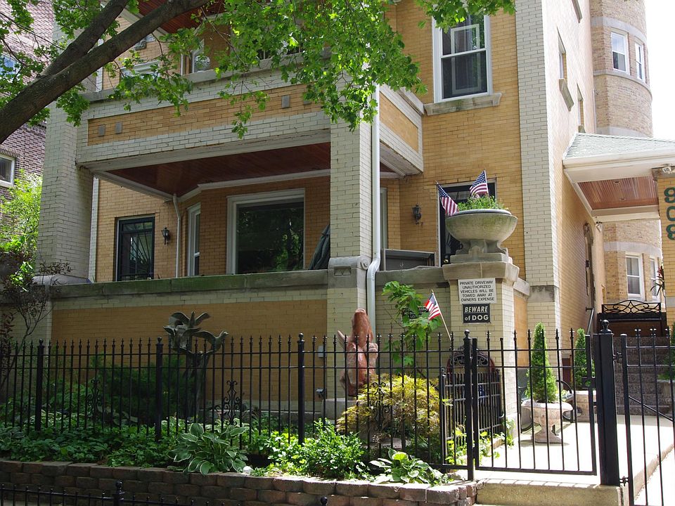 Front of building unit is by staircase.