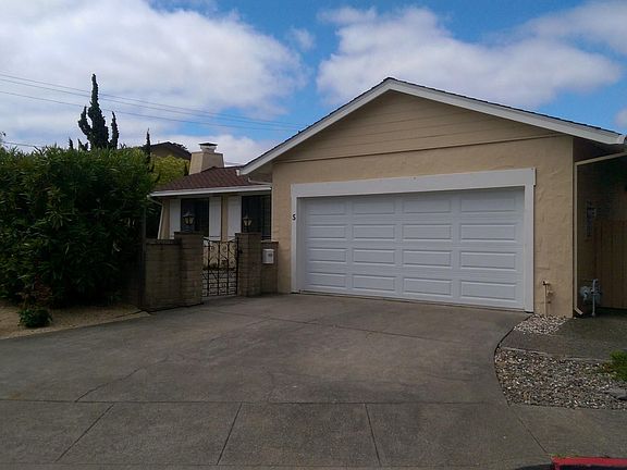 private entry; large two car garage with additional parking in driveway. Storage galore in garage