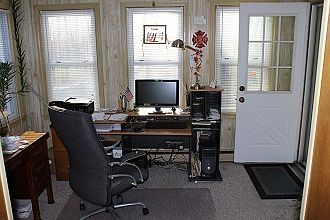 Den from kitchen
						:
						Front entrance from patio (door on right).