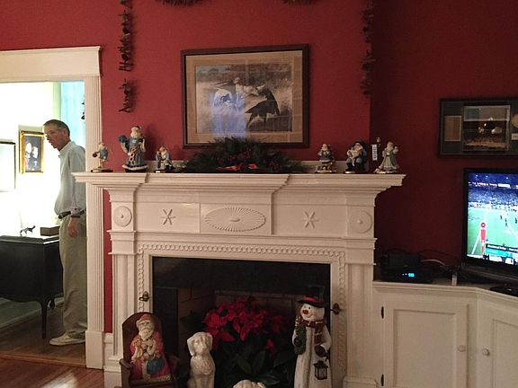 Library with built in bookcase wall and with Jacob Holt mantel.