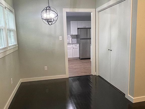 Dining area with entrance to kitchen. Indoor laundry hookups are located inside the closet.