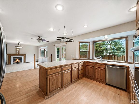 Beautiful well-equipped kitchen w/ stainless appliances. Check out that kitchen sink view!