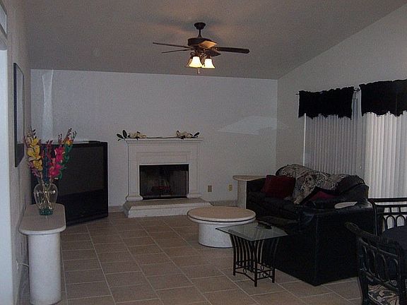 Great room with vaulted ceilings, fireplace and formal dining room