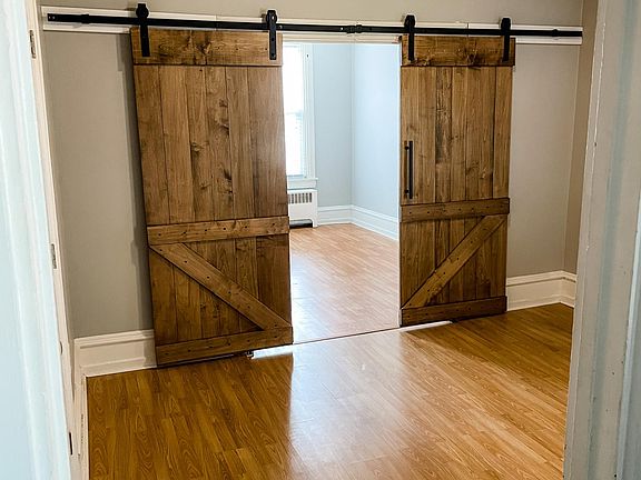 Living Room with Bedroom #1 behind barn doors