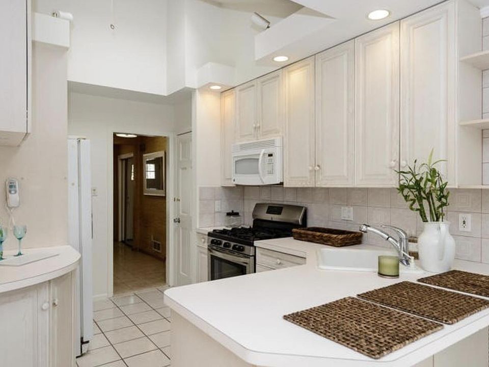 Kitchen with skylight and vaulted ceiling
